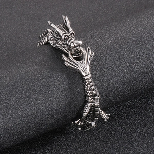 Macro shot of retro stainless steel dragon bracelet featuring intricate scale textures