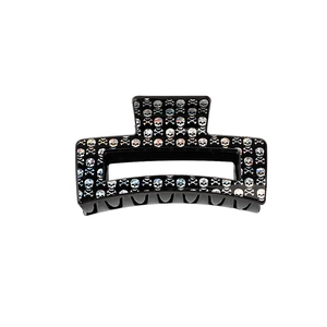 Halloween black rectangular hair claw clip with silver skull and crossbones print
