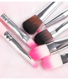 Macro detail of high-quality fiber makeup brush bristles with pink and silver handles