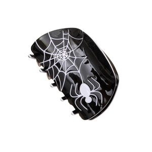 Halloween acetate hair claw clip featuring black spider web and spider pattern on white background