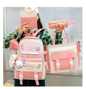 Five-piece pink and white backpack set including tote and pencil case with plush charms