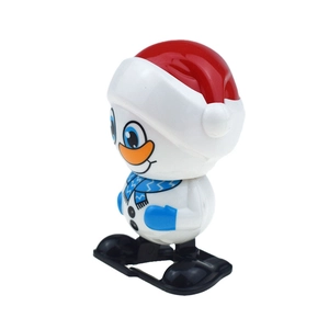 Detail of a wind-up snowman toy with red hat and blue scarf on a clean white background
