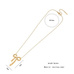 Detail view of golden stainless steel bow necklace with size and weight measurements