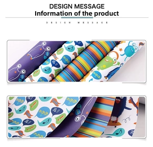 Detail view of colorful cartoon monster and striped gift wrapping paper rolls for kids