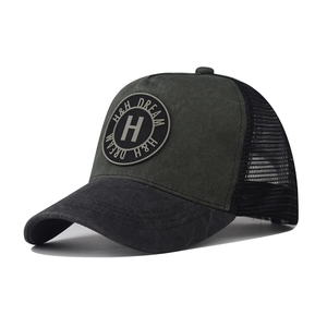 Detail of army green washed cotton trucker hat with breathable black mesh and H logo