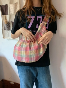 Large colorful checkered canvas shoulder bag with pleated crescent shape and wide strap