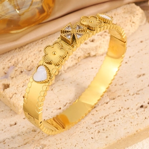 Gold-tone titanium steel flower heart bangle with cubic zirconia and white enamel inserts