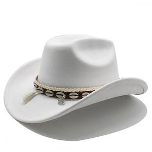 Detail of white suede cowboy hat with fringe, ethnic shell beads and vintage coin