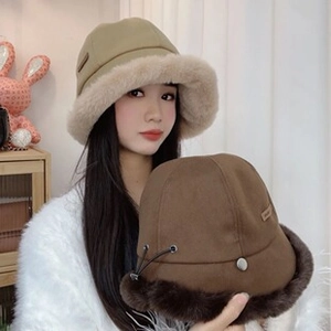 Detail of plush faux fur bucket hat with adjustable drawstring and metal eyelets