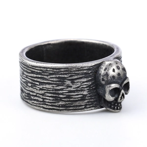 Vintage punk skull ring in antique silver finish with textured grooved band for men and women