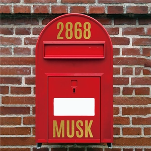 Detail of 2.5 inch gold lettering stickers on a red metal mailbox with house numbers