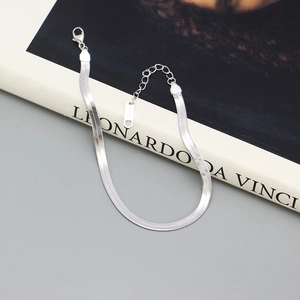 Detailed close-up of S925 sterling silver flat snake chain bracelet with lobster clasp