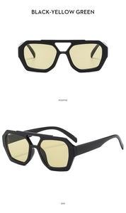 Front and side view of black double-bridge aviator sunglasses with yellow-green lenses