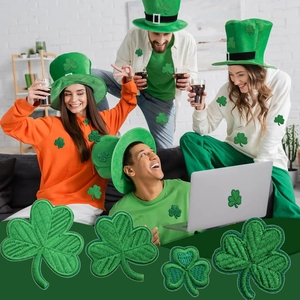 Saint Patrick's Day green clover embroidery patches applied on clothes and laptop