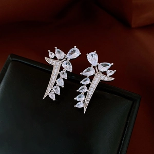Close-up of silver drop leaf earrings featuring sparkling pear-cut zircon stones