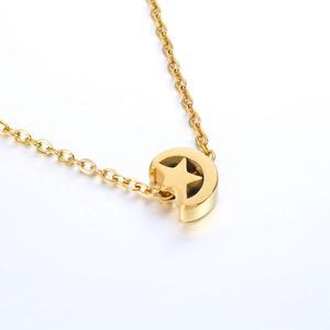 Polished gold moon and star pendant necklace on a delicate chain for women