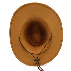 Close-up of a brown suede cowboy hat featuring a braided chin strap and wide brim detail