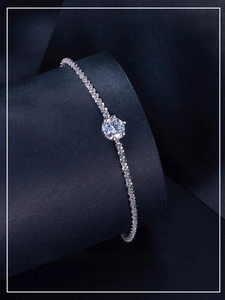 Macro shot of a 1ct round moissanite bracelet with polished S925 sterling silver chain