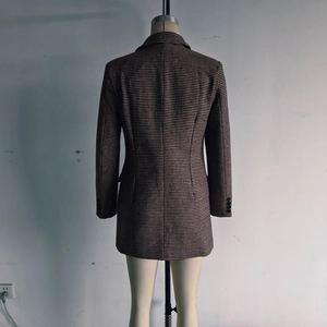 Detailed rear view of brown houndstooth mid-length blazer jacket with woven texture