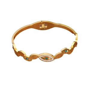 Golden stainless steel evil eye bangle with blue gemstone and white rhinestones