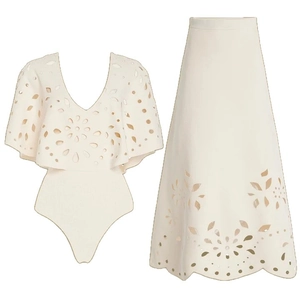 White two-piece swimwear set featuring hollow-out floral lace and ruffled V-neck details