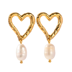 Elegant gold heart earrings with hammered metal finish and hanging freshwater pearls