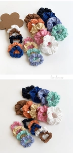 Detail of colorful cotton scrunchies with natural pleats and soft texture for hair