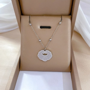Minimalist titanium steel Ruyi lock necklace with Fu character in a beige jewelry box