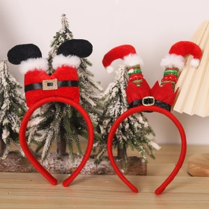 Christmas headband set with Santa and elf leg designs on a festive wooden surface
