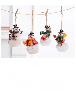 Close-up of vintage iron Christmas pendants featuring colorful hand-painted snowmen details