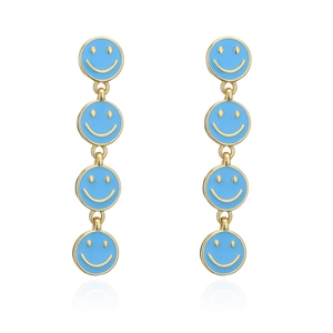 Detail view of long golden earrings featuring four linked blue enamel smiley face pendants