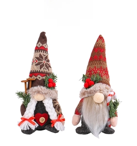 Detail of Christmas gnomes with knitted hats, white braids and candy cane accessories