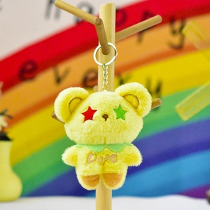 Mignon porte-clés ours en peluche jaune avec yeux en étoile et broderie Dope détaillée
