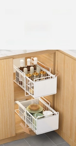 Close-up of a white two-tier sliding pull-out organizer shelf for kitchen cabinets