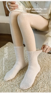 Detailed close-up of thickened thermal fleece socks with a comfortable ribbed cuff design
