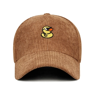 Brown corduroy baseball cap featuring a yellow cartoon duck embroidery on white background