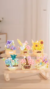 Detailed view of six assorted building block flower baskets on a wooden display stand