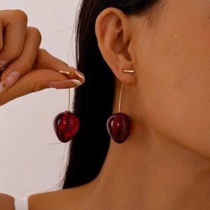 Cute cherry acrylic earrings with glitter details and long gold metal needles