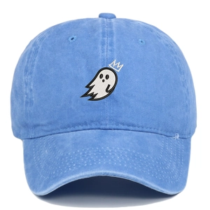 Detailed close-up of crown ghost embroidery on light blue washed denim baseball cap