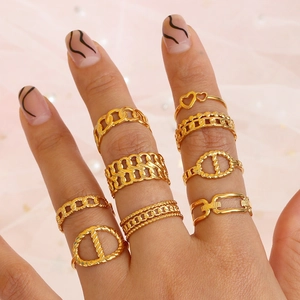 9-piece gold stainless steel ring set with Cuban link and heart designs for women