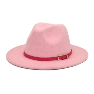 Close-up of pink wool fedora hat with fuchsia belt strap and golden metal buckle detail
