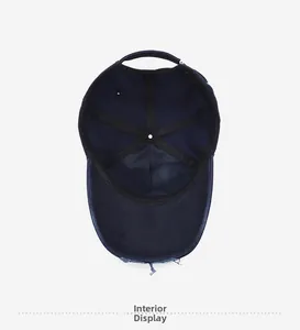 Detail view of the navy baseball cap interior with vintage distressed brim and sweatband
