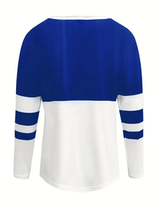 Detail of blue and white color-block long sleeve sweatshirt with striped cuffs