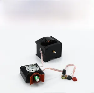 Internal mechanism of cuckoo clock with speaker, colorful wires and bird module detail