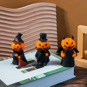 Detailed view of Halloween pumpkin figurines including wizard, gentleman, and devil styles