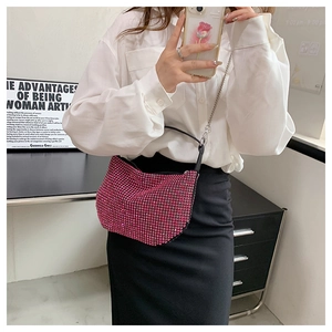 Chic pink rhinestone shoulder bag with metal chain strap shown in a lifestyle mirror selfie
