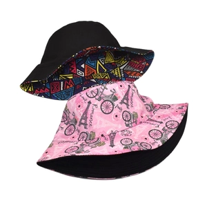 Reversible geometric tribal and romantic Paris print wide brim cotton bucket sun hat