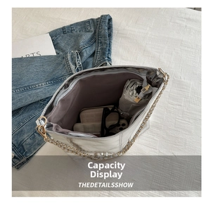 Silver metallic tote bag interior view showing space for phone wallet and umbrella