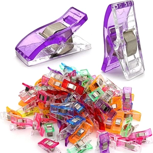 Multi-colored plastic sewing clips for fabric quilting and DIY crafts in a bulk set