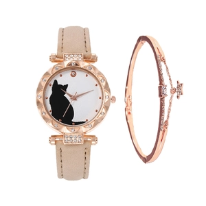 Detail view of rose gold cat motif watch and rhinestone star bracelet jewelry set